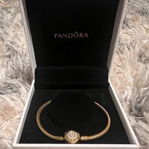 Gold Pandora bracelet with crystal accents